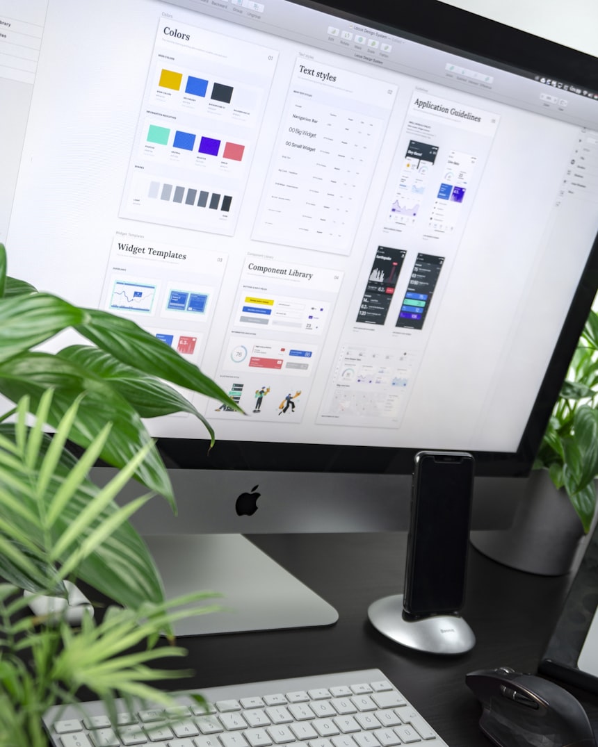 Web designer reviewing bespoke website layout options on screen