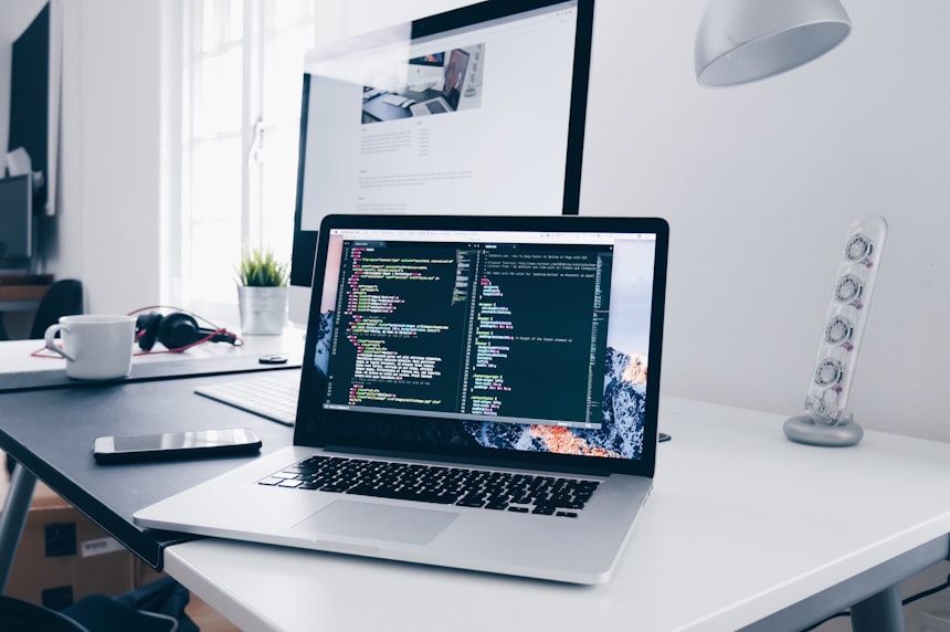 Developer working on a website redesign at a laptop
